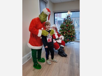 Santa and the Grinch Spotted at Zuber Insurance and Realty